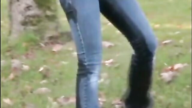 Pissing in jeans outdoors