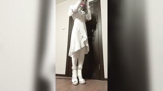 Crossdresser in white velvet velour outfit hanging breathplay