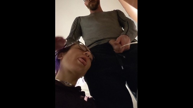 pixie with her fat tongue out waits next to Master while He's pissing then licks the dripping tip