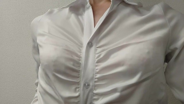 Crossdresser (pink bra is seen through the blouse)
