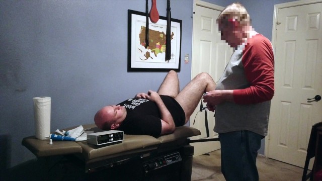 Sir G gives me a medical exam before hooking up the electro to my cock and butt while spanking me