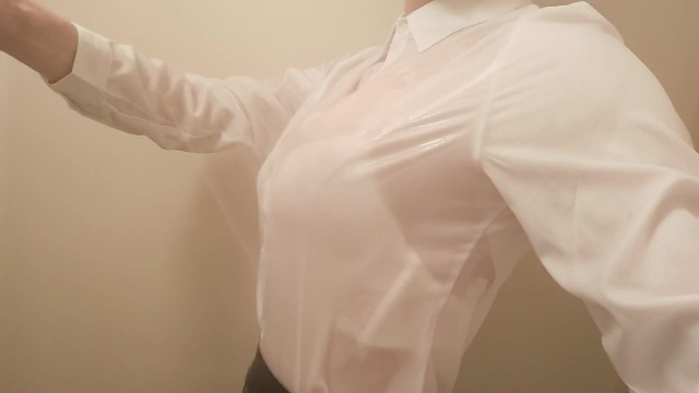 Crossdresser is taking a shower with my clothes on. Bra is seen through my blouse.