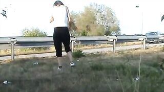 Woman shit near the road