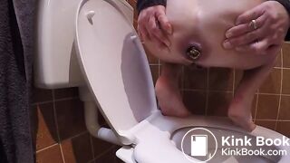 Constipated struggle over toilet
