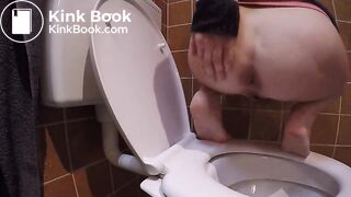 Constipated struggle over toilet