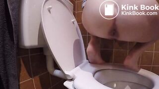 Constipated struggle over toilet