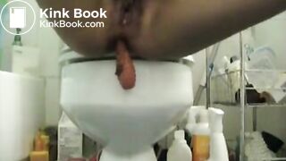 Teen with bush pushes dildo with big shit