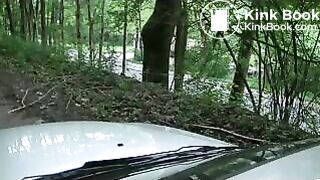 Girl liquid shitting on a white car hood