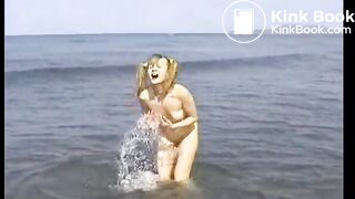 Girl poos in the sea