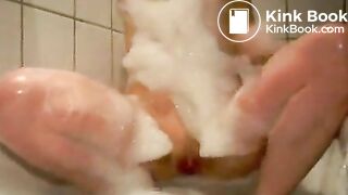 Young girl two floaters in bathtub