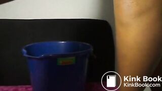 Shitting in Blue Bucket