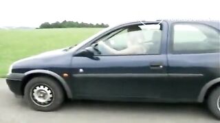 Girl shitting standing near the black car - Pooping and piss