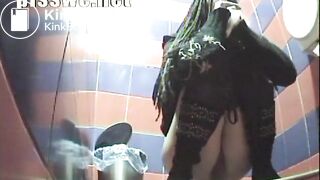 beautiful girl suffering from diarrhea in a public toilet