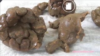 Huge compacted turds stretch her anus wide