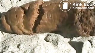 Babe pooping on a sandy beach