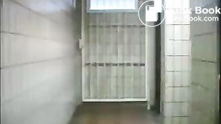 Squirting enema in public toilet 