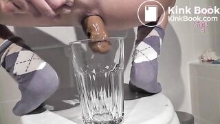 Long turd shit into a glass