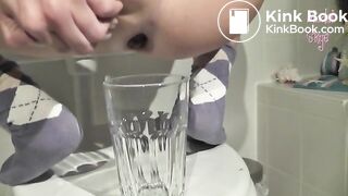 Long turd shit into a glass