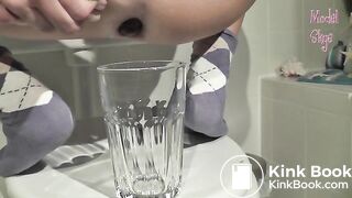 Long turd shit into a glass