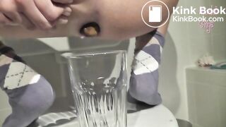 Long turd shit into a glass