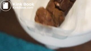 cute girl poops in a plastic food container