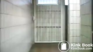 Squirting enema in public toilet entrance