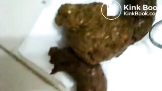 Playing with her poop