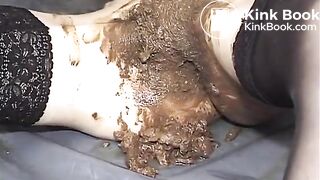 Smearing brown poop on a brunette slut