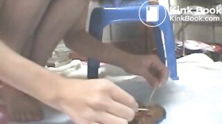 Asian Girl examins her shit