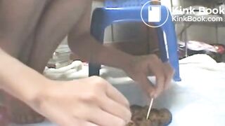 Asian Girl examins her shit