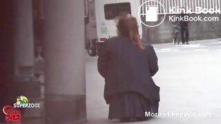 Behind car