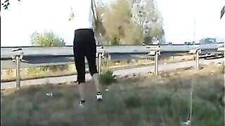 Woman shit near the road