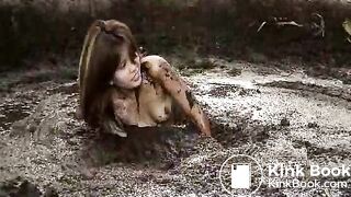 Girl rolling in pig shit pit