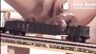 Woman Shits on a Model Train