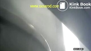 woman vomiting in public toilet