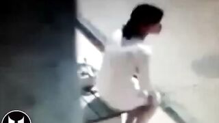 Woman Shitting At Bus Stop
