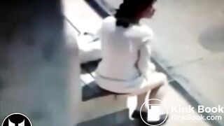 Woman Shitting At Bus Stop