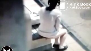 Woman Shitting At Bus Stop