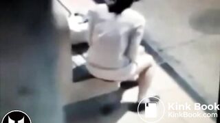 Woman Shitting At Bus Stop