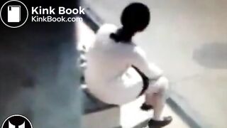 Woman Shitting At Bus Stop