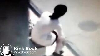 Woman Shitting At Bus Stop