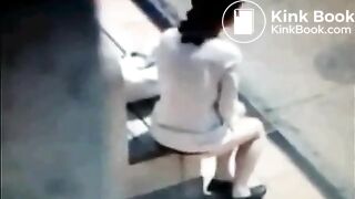 Disgusting bitch takes a shit on a bus stop bench