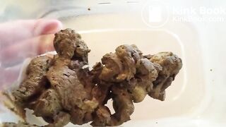 Vanessa shitting into a plastic container