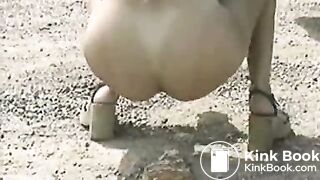 Brunette poops outdoor