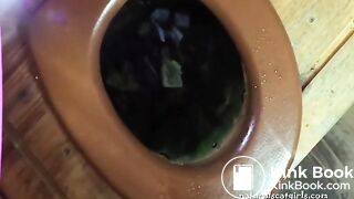 Woman scat in toilet with a beautiful view from the window