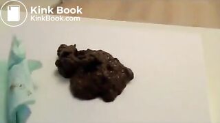 Anya pooping on table