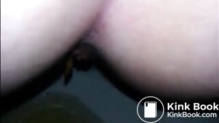 Girl shitting diarrhea in the toilet closeup