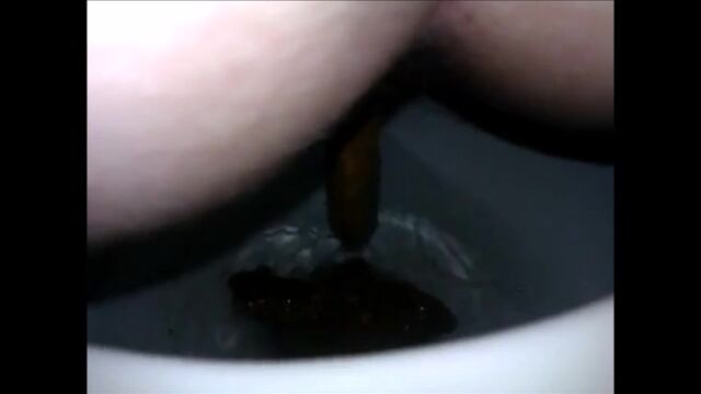 Girl shitting diarrhea in the toilet closeup
