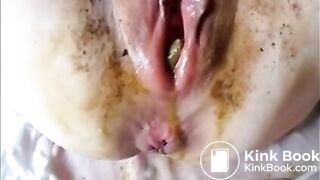 Dirty lady eject a piece of shit from her cunt