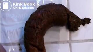 Woman shitting a long hard turd
